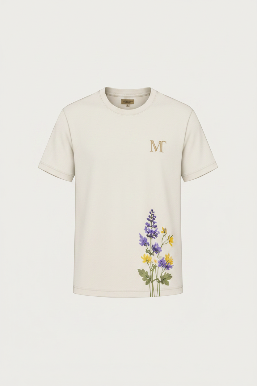 Man wearing a white t-shirt with floral design, product details, and brand information.