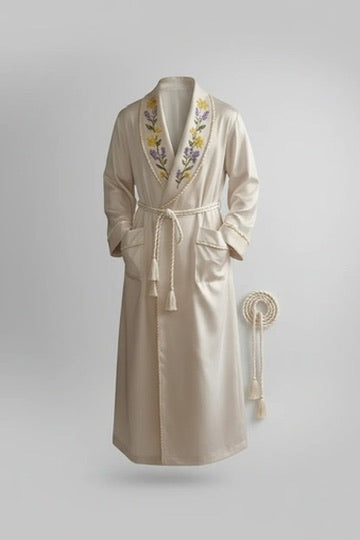 Beige robe with floral embroidery on a light gray background