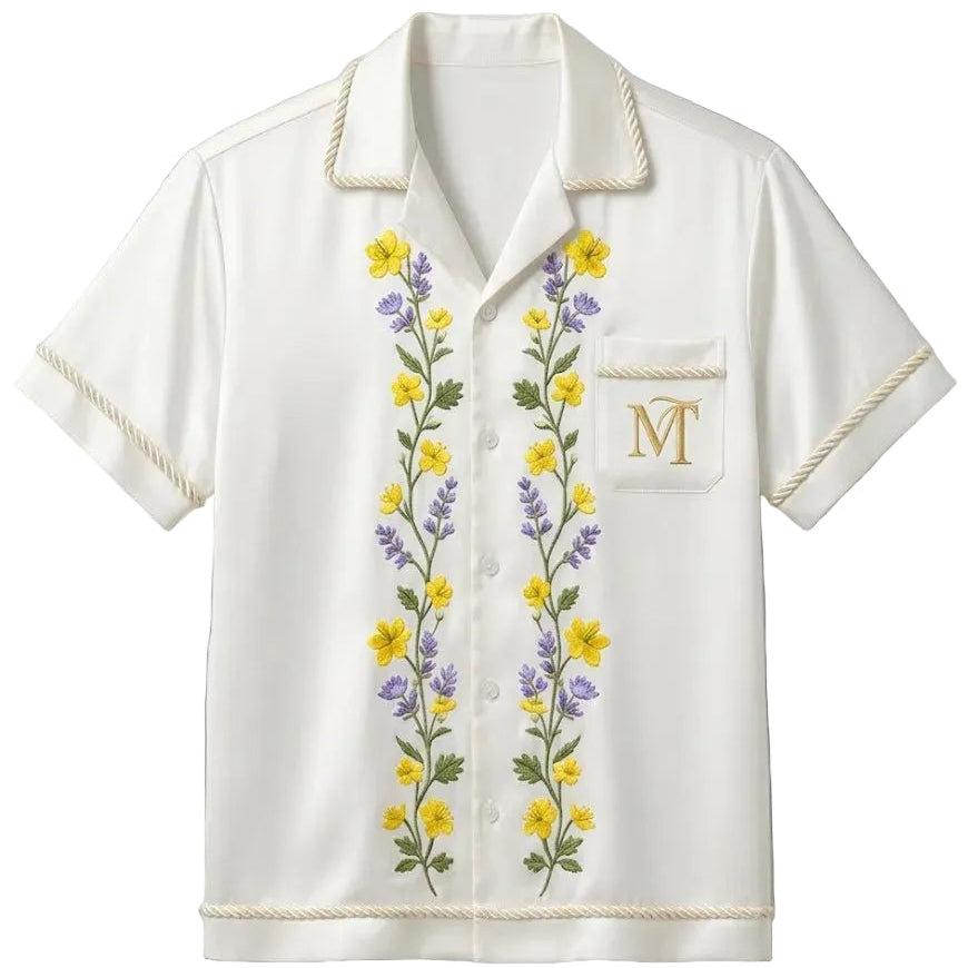 White shirt with floral embroidery on a light gray background