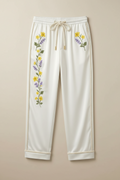 Manolo Theodoro men's loungewear collection with floral designs on a neutral background